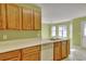 The kitchen has wood cabinets, a stainless steel sink, and a dishwasher, perfect for cooking enthusiasts at 2878 Norfair Loop, Lithonia, GA 30038