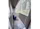 Cozy balcony with wooden planks and view of the beautiful trees outside at 4079 Woodridge Way, Tucker, GA 30084