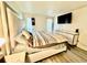 View of the bedroom featuring a large bed, hardwood floors, and a TV at 4079 Woodridge Way, Tucker, GA 30084