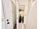 View of the hallway with wood floors, white walls, and a closet at 4079 Woodridge Way, Tucker, GA 30084