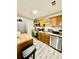 View of the kitchen featuring a microwave, oven, dishwasher, and stainless steel refrigerator at 4079 Woodridge Way, Tucker, GA 30084