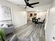 Bright, open-concept with sleek floors and view into a dining area and kitchen at 4079 Woodridge Way, Tucker, GA 30084