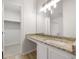 Bathroom with granite countertop and a large mirror at 2600 Sims Crest Ct, Snellville, GA 30078