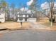 Two-story house with a white exterior and attached garage at 2600 Sims Crest Ct, Snellville, GA 30078