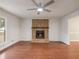 Living room with hardwood floors and brick fireplace at 2600 Sims Crest Ct, Snellville, GA 30078