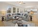 Bright living room features a large sectional sofa, hardwood floors, and natural light at 2712 Sw Riverpine Lot 175 Sw Trl, Atlanta, GA 30331