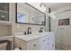 Modern bathroom with dual sinks, matte black faucets, and shower with decorative tile at 2848 Monticello Pl, Decatur, GA 30030