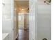 Bathroom with classic white tiles, a shower, and an adjoining hallway at 2720 Santa Barbara Nw Dr, Atlanta, GA 30318