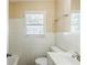 Simple bathroom featuring classic white tiles, a window, and a pedestal sink at 2720 Santa Barbara Nw Dr, Atlanta, GA 30318
