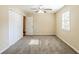 Well-lit bedroom featuring neutral walls, carpet flooring, a ceiling fan and a closet at 2720 Santa Barbara Nw Dr, Atlanta, GA 30318