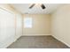 Bedroom featuring neutral walls, carpet flooring, a ceiling fan, and a window at 2720 Santa Barbara Nw Dr, Atlanta, GA 30318