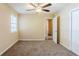 Bedroom featuring neutral walls, carpet flooring, a ceiling fan, and a closet at 2720 Santa Barbara Nw Dr, Atlanta, GA 30318