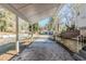 Long carport leading up to the house, with mature trees in the background at 2720 Santa Barbara Nw Dr, Atlanta, GA 30318