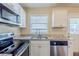 Bright space with a new stainless steel dishwasher and granite countertops at 2720 Santa Barbara Nw Dr, Atlanta, GA 30318