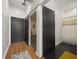 Hallway with wood floors, access to bathroom and other rooms at 260 18Th St # 10320, Atlanta, GA 30363