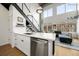 Modern kitchen with white cabinets, island, and stainless steel appliances at 260 18Th St # 10320, Atlanta, GA 30363