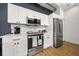 Modern kitchen with white cabinets and stainless steel appliances at 260 18Th St # 10320, Atlanta, GA 30363