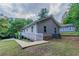 Backyard view of home featuring a ramp, siding, and greenery at 804 Thomasville Se Blvd, Atlanta, GA 30315