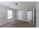 Spacious bedroom with neutral walls and carpet, featuring a window and closet at 804 Thomasville Se Blvd, Atlanta, GA 30315
