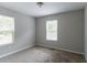Neutral bedroom with carpet, featuring two windows for natural light and a clean, simple design at 804 Thomasville Se Blvd, Atlanta, GA 30315