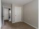 Cozy bedroom with neutral walls and carpet, featuring a white door and trim at 804 Thomasville Se Blvd, Atlanta, GA 30315