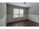 Cozy dining room featuring wainscoting detail and natural light from two windows at 804 Thomasville Se Blvd, Atlanta, GA 30315