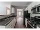 Well-equipped kitchen with stainless steel appliances and granite countertops at 804 Thomasville Se Blvd, Atlanta, GA 30315