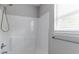 Shower featuring a white surround and updated fixtures at 804 Thomasville Se Blvd, Atlanta, GA 30315