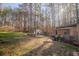 Large backyard featuring various sheds and a chicken coop, offering ample space at 1620 Palm St, Canton, GA 30115