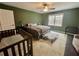 Bedroom with a large window, neutral colors, and a pet-friendly area at 1620 Palm St, Canton, GA 30115