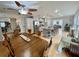 Spacious dining room open to the kitchen features ample natural light and wood floors at 1620 Palm St, Canton, GA 30115
