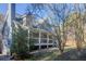 Charming home with a covered front porch and well-manicured landscaping at 1620 Palm St, Canton, GA 30115