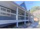 Gray house with a large front porch and black railings at 1620 Palm St, Canton, GA 30115