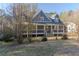 Charming home with covered porch perfect for relaxing and enjoying the outdoors at 1620 Palm St, Canton, GA 30115