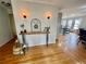 Inviting foyer with hardwood floors, decorative lighting and stylish console table at 1620 Palm St, Canton, GA 30115