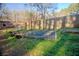 Spacious garden with a wooden fence and small plants in pots ready to be planted at 1620 Palm St, Canton, GA 30115
