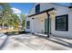 Modern house with light green front door and concrete walkway at 2442 Connally Dr, Atlanta, GA 30344