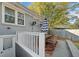 Back patio with seating area and white railing at 2742 Oakland Ter, Decatur, GA 30032