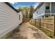 Shared driveway between two houses with a gate at 1318 Graymont Sw Dr, Atlanta, GA 30310