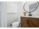 Stylish bathroom with wood vanity, marble countertop, and mirror at 1386 Sandy Ln, Decatur, GA 30032