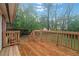 Wooden deck overlooks a fenced backyard at 1386 Sandy Ln, Decatur, GA 30032