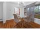 Bright dining room with hardwood floors and a glass-top table at 1386 Sandy Ln, Decatur, GA 30032