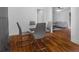 Bright dining room with hardwood floors and a glass-top table at 1386 Sandy Ln, Decatur, GA 30032