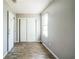 Bedroom with wood-look floors, grey walls, and a closet at 1405 Pinehurst Sw Dr, Atlanta, GA 30311