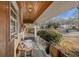 View of a covered porch with a wood ceiling, outdoor table, and railing at 1405 Pinehurst Sw Dr, Atlanta, GA 30311