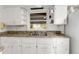 A kitchen featuring a double basin sink and white cabinets at 1405 Pinehurst Sw Dr, Atlanta, GA 30311