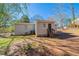 View of the backyard with a grass lawn, trees, and partial fencing at 16 Bromack Se Dr, Atlanta, GA 30315