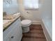 Bathroom with granite countertop, toilet, and white tiled walls at 16 Bromack Se Dr, Atlanta, GA 30315