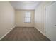 Bedroom featuring a window, carpeting, and a closet at 16 Bromack Se Dr, Atlanta, GA 30315