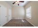 Cozy bedroom with plush carpeting, a ceiling fan, and a window letting in natural light at 16 Bromack Se Dr, Atlanta, GA 30315